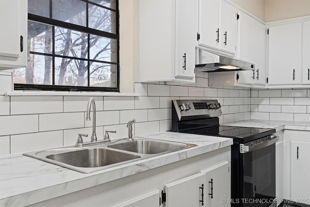 kitchen featuring backsplash, sink, white cabinets, and stainless steel electric range