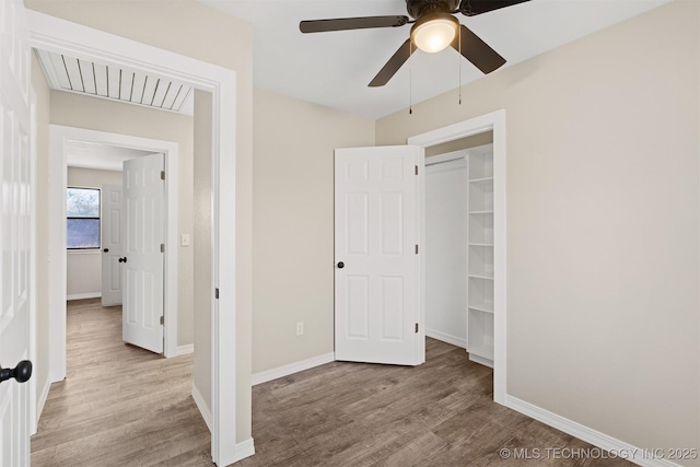 unfurnished bedroom featuring a closet, ceiling fan, and light hardwood / wood-style flooring