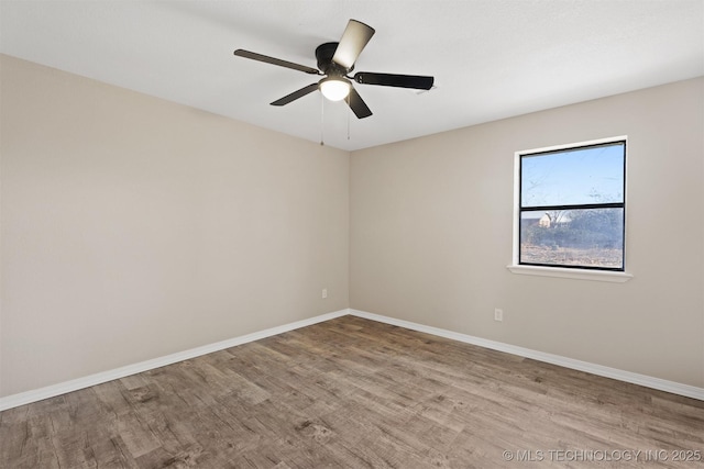 spare room featuring ceiling fan and light hardwood / wood-style floors