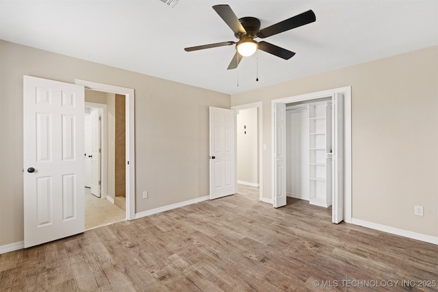 unfurnished bedroom with light wood-type flooring, a closet, and ceiling fan