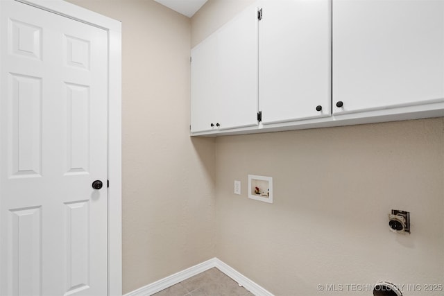 laundry room featuring hookup for a washing machine, light tile patterned floors, cabinets, and hookup for an electric dryer