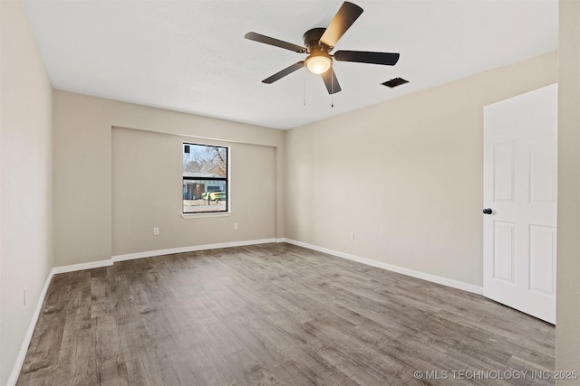 unfurnished room featuring ceiling fan and wood-type flooring