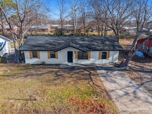 ranch-style house with a front lawn