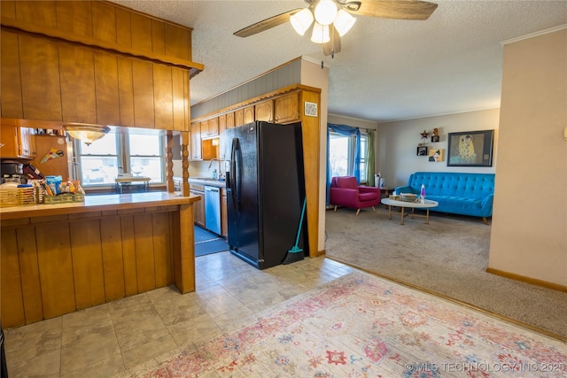 kitchen with ceiling fan, dishwasher, tile countertops, light colored carpet, and black refrigerator