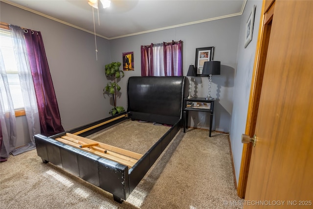 carpeted bedroom with ornamental molding