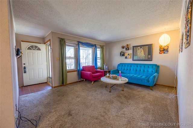 living room featuring carpet floors and a textured ceiling