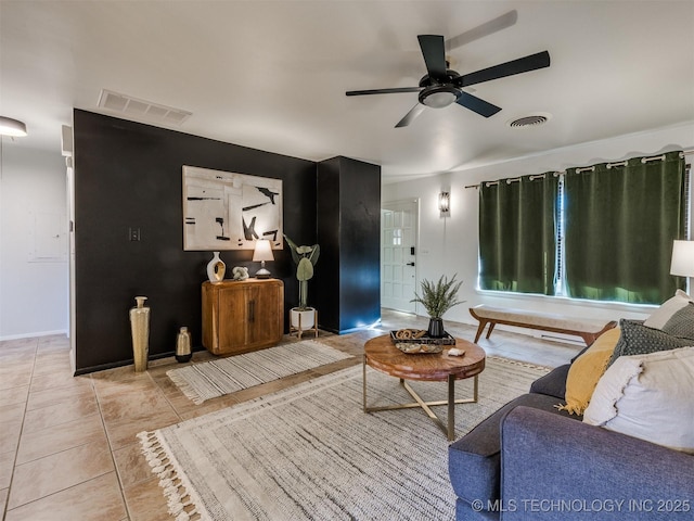 tiled living room featuring ceiling fan