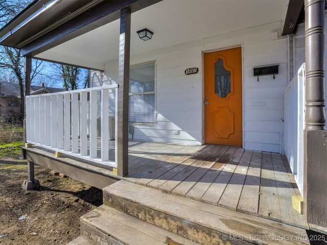 doorway to property featuring covered porch