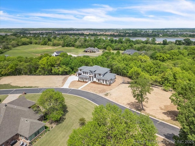 5835 E 139th St S, Bixby, OK 74008 - drone / aerial view of a tree filled landscape and a nearby body of water