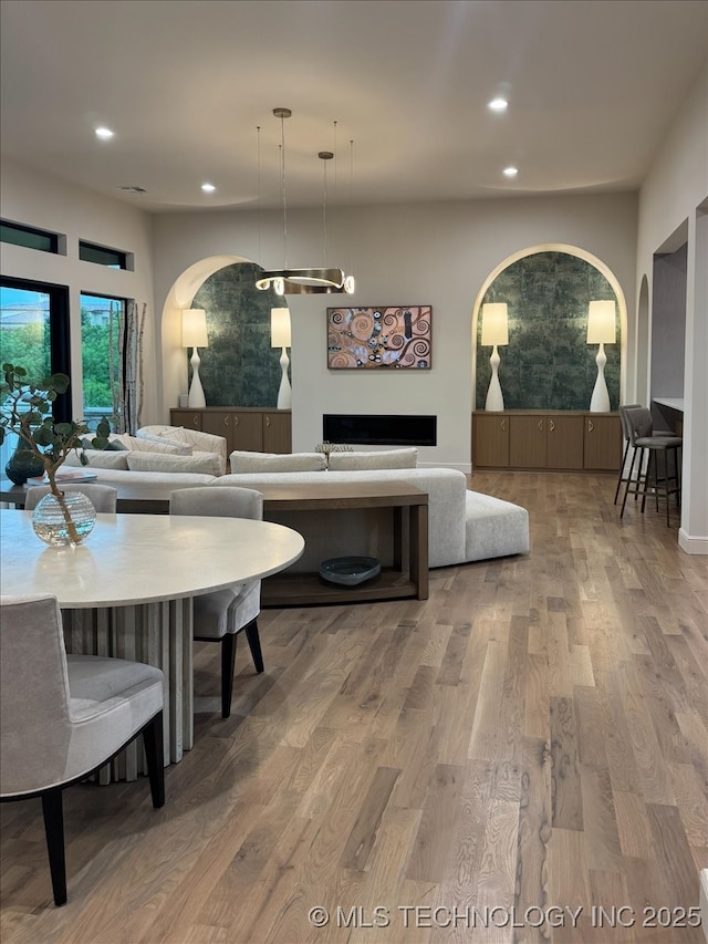 5835 E 139th St S, Bixby, OK 74008 - dining space with wood finished floors, recessed lighting, and a fireplace