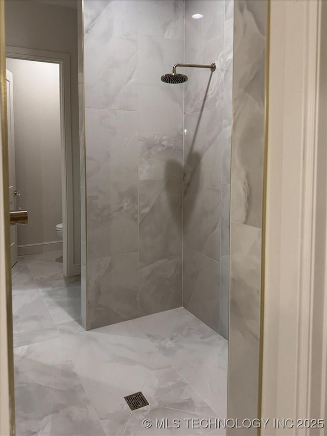 5835 E 139th St S, Bixby, OK 74008 - bathroom featuring a tile shower and marble look tiles