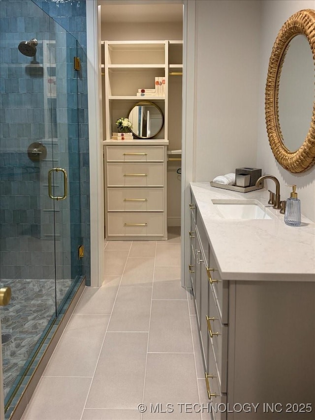 5835 E 139th St S, Bixby, OK 74008 - bathroom with vanity, tile patterned floors, a stall shower, and a closet