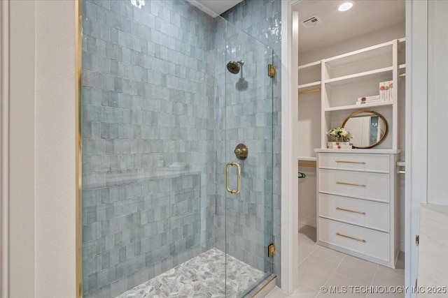 5835 E 139th St S, Bixby, OK 74008 - bathroom with a stall shower, a spacious closet, and tile patterned floors
