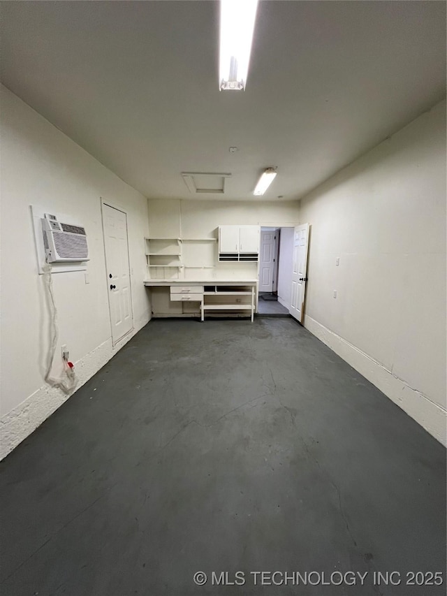 basement with a wall mounted air conditioner