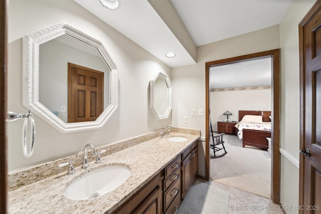 bathroom with tile patterned floors and vanity