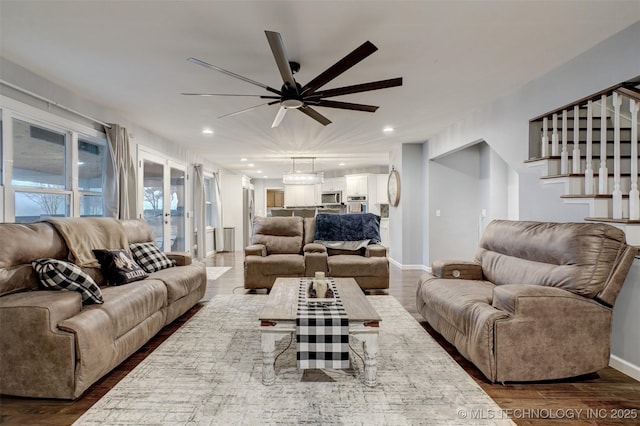 living room featuring a ceiling fan, recessed lighting, dark wood-style floors, and baseboards