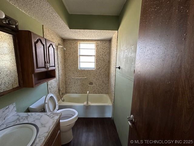 full bathroom with shower / bathing tub combination, vanity, toilet, and wood-type flooring