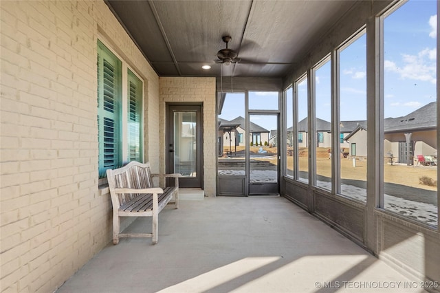 sunroom / solarium with ceiling fan