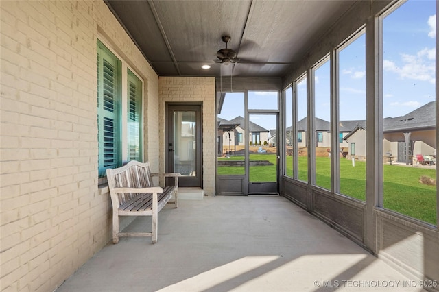1109 W 84th Pl S, Tulsa, OK 74132 - sunroom / solarium featuring ceiling fan and a residential view