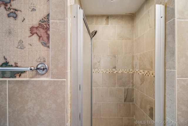 bathroom with a shower with shower door