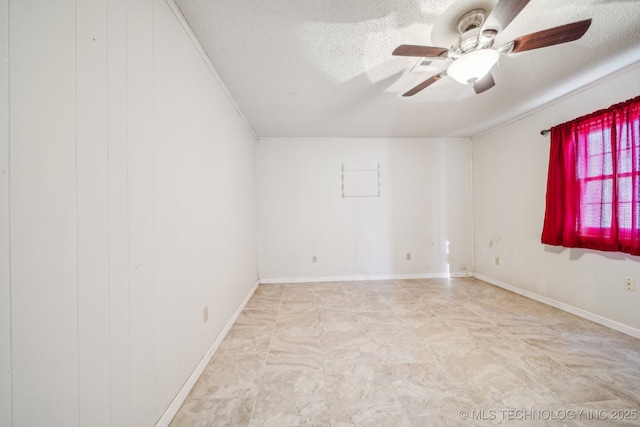 spare room featuring a textured ceiling and ceiling fan