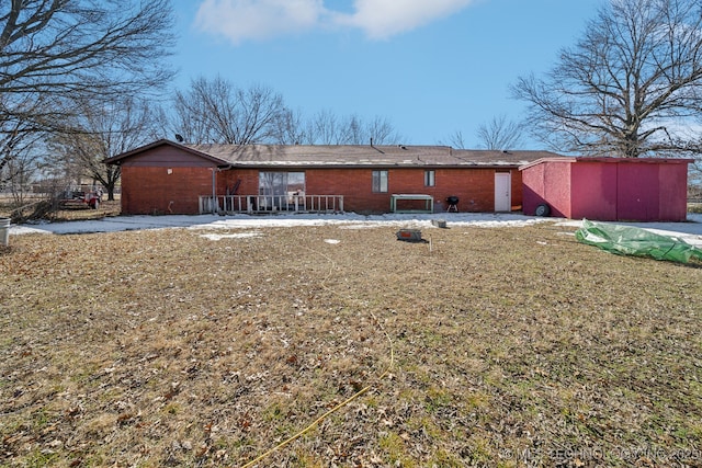 rear view of house with a yard