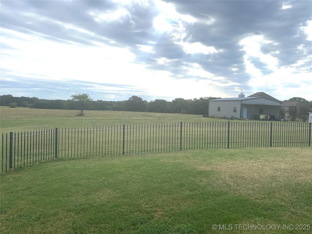 view of yard with a rural view