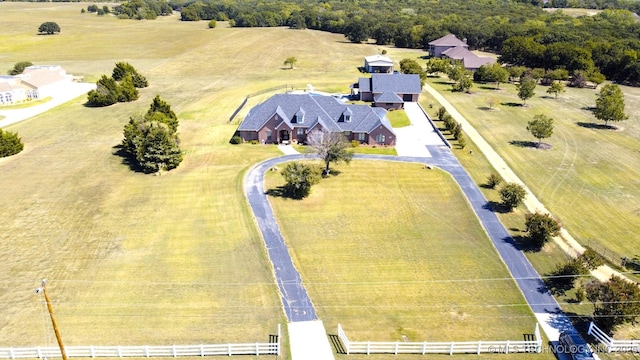 birds eye view of property with a rural view