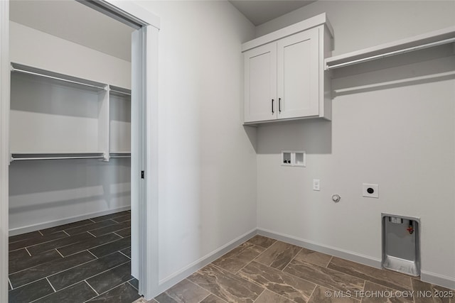 clothes washing area featuring cabinets, washer hookup, gas dryer hookup, and hookup for an electric dryer