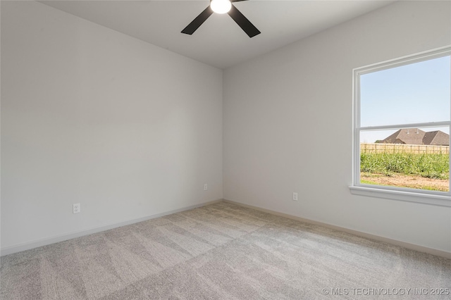 carpeted empty room with ceiling fan