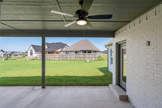 view of yard featuring ceiling fan and a patio area