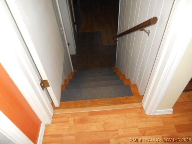 stairs with hardwood / wood-style floors