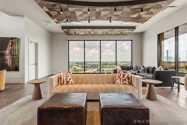 405 N Main St Unit 4A, Tulsa, OK 74103 - living room featuring plenty of natural light and wood-type flooring