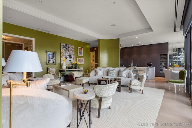 living room featuring a tray ceiling