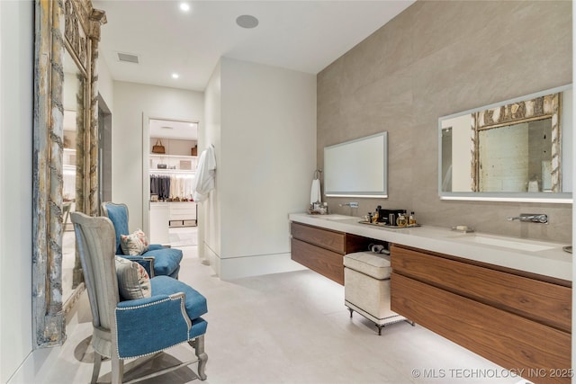 405 N Main St Unit 4B, Tulsa, OK 74103 - full bathroom with double vanity, a walk in closet, and recessed lighting