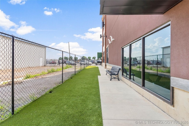 view of property's community with a lawn