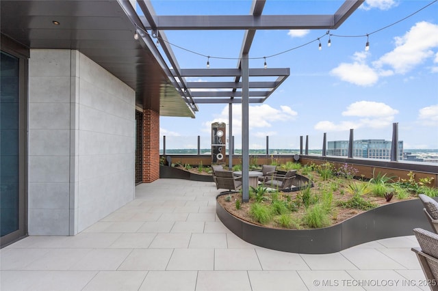 view of patio with an outdoor fire pit