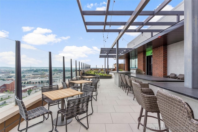 view of patio featuring an outdoor bar