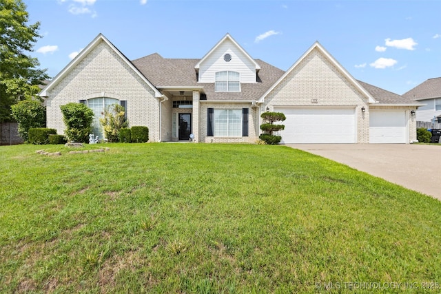 view of front of house featuring a front yard and a garage