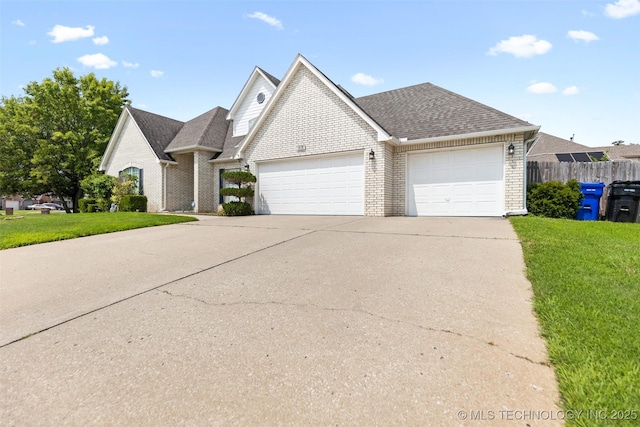 view of front of home with a garage and a front yard