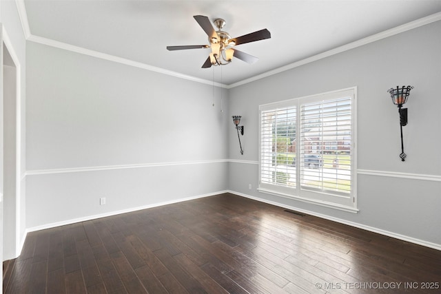 empty room featuring ceiling fan, dark wood-type flooring, and ornamental molding