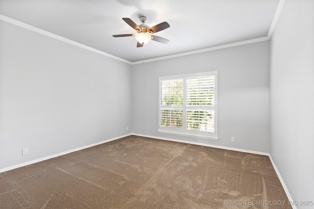 carpeted empty room with ceiling fan and crown molding