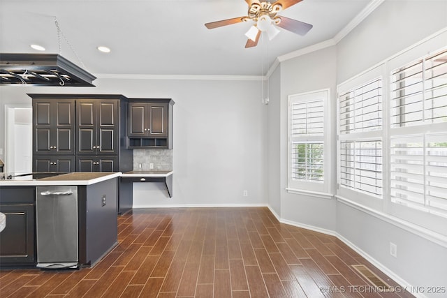 kitchen featuring ceiling fan, ornamental molding, dark wood-type flooring, and tasteful backsplash