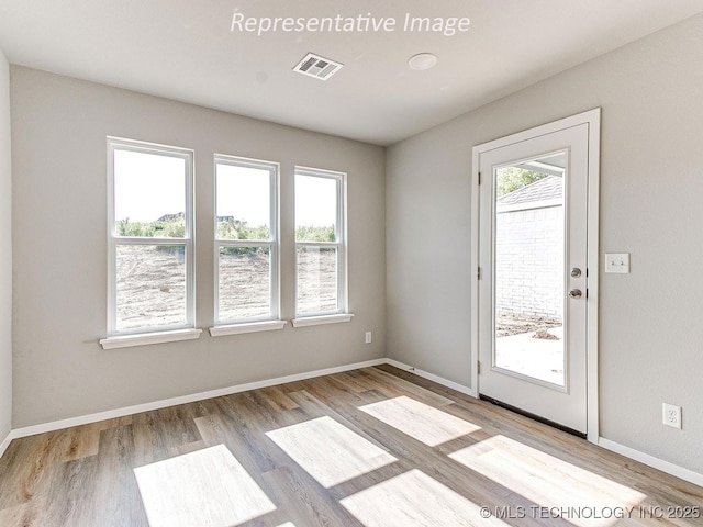 spare room featuring light wood-type flooring