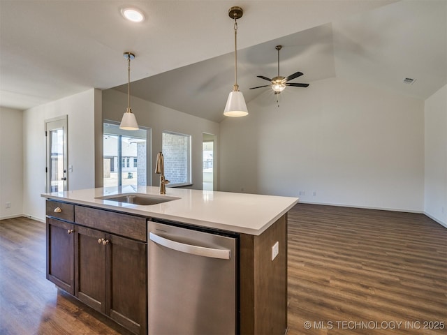 kitchen with a sink, stainless steel dishwasher, open floor plan, and dark wood-style flooring