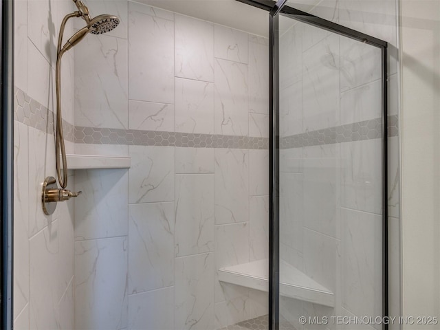 bathroom with a shower stall