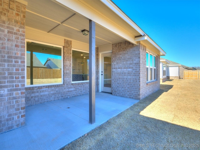 view of patio / terrace featuring fence