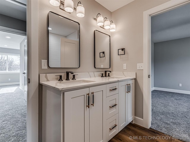 bathroom with vanity and hardwood / wood-style floors