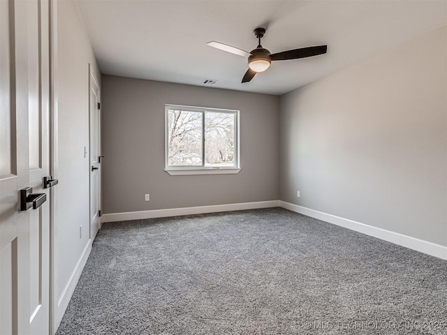 empty room with carpet flooring and ceiling fan