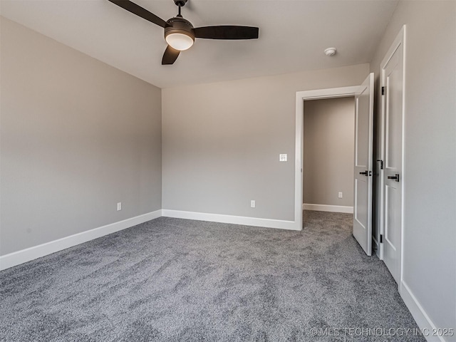 spare room featuring carpet flooring and ceiling fan